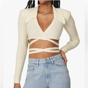 WeWoreWhat knit wrap top with shoulder pads. Size S. Light cream color